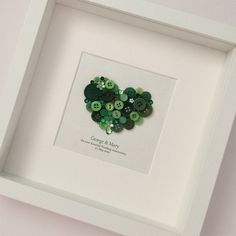 a white frame with buttons in the shape of a heart