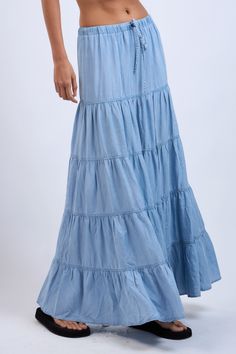 The Denim Days Maxi Skirt features a lightweight denim fabric and tiered ruffle design. Perfect for year-round wear and has an drawstring waistband for all-day comfort Material & Care: Made from 100% Tencel. For best care, machine wash cold with like colors on a gentle cycle. Use a mild detergent. Avoid bleach. Hang to dry. Iron on low heat if needed Size & Fit: Model is 5'8" wearing size small Bust: 34B Waist: 24 Hips: 34 Tiered Denim Skirt For Spring, Spring Medium Wash Tiered Skirt, Denim Blue Tiered Cotton Skirt, Summer Denim Tiered Maxi Skirt, Denim Tiered Maxi Skirt For Summer, Denim Blue Tiered Skirt For Summer, Summer Medium Wash Tiered Skirt, Cotton Denim Blue Tiered Skirt, Medium Wash Cotton Tiered Skirt