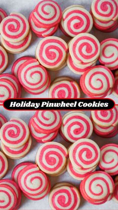 some pink and white cookies with red swirls on them in the shape of spirals