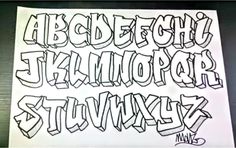 the letters are drawn on paper with black ink