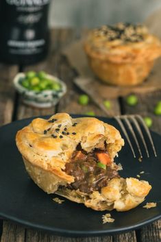 a piece of meat pie on a plate with a fork