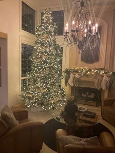 a living room filled with furniture and a christmas tree