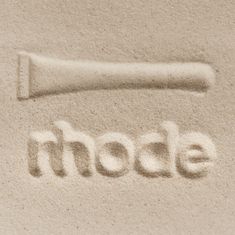 the word mode is written in sand with a baseball bat on it's side