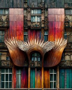 an art deco building with large wooden sculptures on it's side