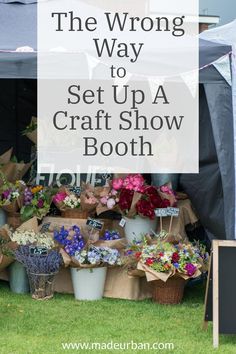 the wrong way to set up a craft show booth with lots of flowers and plants