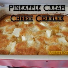 a casserole dish with pineapple cream cheese cobbler in the bottom layer