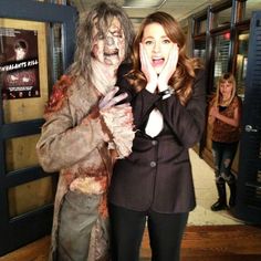 two people dressed as zombies posing for the camera