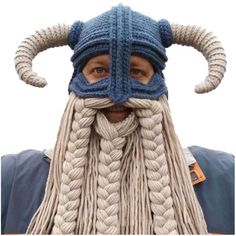 a man wearing a knitted viking hat and braided beard with horns on his head