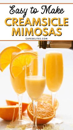 three glasses filled with orange juice next to sliced oranges