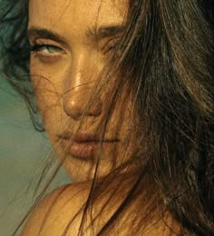 a close up of a woman with wet hair