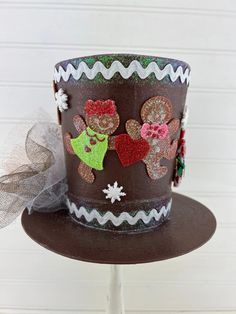 a brown hat with some decorations on it