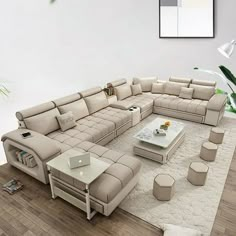 a living room with a large sectional couch and coffee table