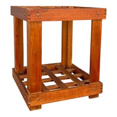 a small wooden table with two legs on each side and one leg raised up to the ground