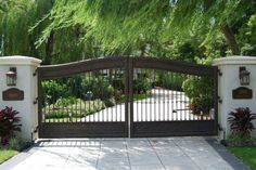 an iron gate in front of a house