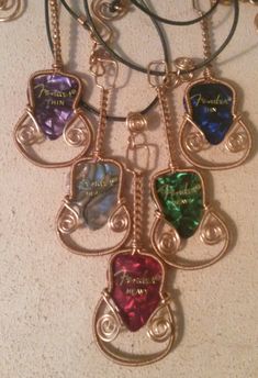 a necklace with five different colored hearts hanging from it