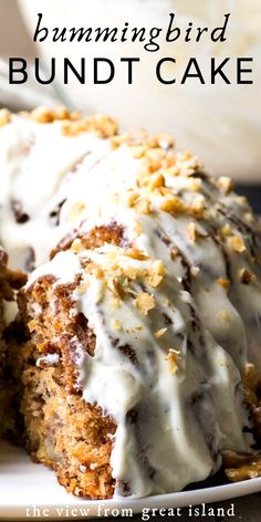 a bundt cake with white frosting and nuts on top