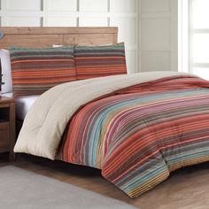 This global zig zag ikat multicolor printed comforter adds spice and flare to any room that needs a lift of color. Reversible and soft, this bold set will bring a fashion forward look to any bedroom. Comforter and shams included (one standard sham included with twin set). Soft polyester microfiber fabric. Machine washable, easy care, check sewn in label for details. Estate Collection Taj Multi-colored Stripe Reversible Full/Queen Comforter Microfiber with (Fill) | 105023 Linen Comforter, Blue Comforter Sets, Cool Comforters, Twin Comforter Sets, Reversible Comforter, Twin Comforter, Blue Home Decor, Bedding Stores, Queen Comforter