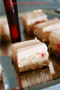 several pieces of cake sitting on top of a metal tray