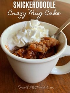 a close up of a cup of food with whipped cream on top and the words, snickkerdoodle crazy mug cake