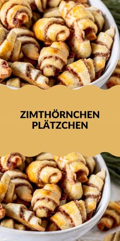 two white bowls filled with cinnamon buns on top of a wooden table next to pine branches