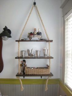 a shelf with some cups and glasses on it