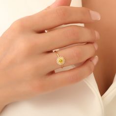 Step into a world of elegance and sophistication with our exquisite 14K Solid Gold Yellow Topaz Ring, an alluring piece that beautifully captures the essence of luxury. This stunning ring features a round-shaped, vibrant yellow topaz at its center, meticulously surrounded by real diamonds that add a touch of sparkle and sophistication. The combination of solid gold and luminous gemstones creates a timeless appearance ideal for any elegant event or casual outing. Yellow topaz, known for its uniqu Yellow Topaz Ring, Topas Ring, Radiant Ring, Elegant Rings, Topaz Jewelry, Topaz Necklace, Topaz Ring, Real Diamonds, Gold Yellow