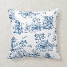 a blue and white toiler print pillow