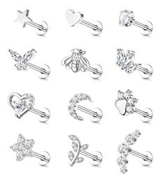 six pairs of piercings with hearts, stars and arrows on them in different styles