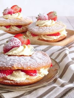 strawberry shortcakes with powdered sugar and strawberries on top