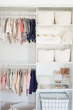 an organized closet with clothes and baskets