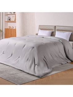 the comforter is made up and ready for someone to use it in their bed