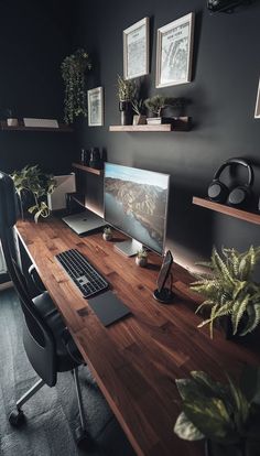 a desk with a laptop and monitor on it