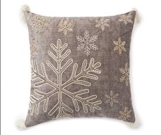 a decorative pillow with snowflakes on it