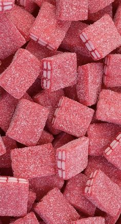 red candy cubes are piled up together