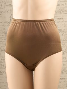 These nylon briefs are designed to offer a no-bunch fit and a smooth look under clothing. . . no panty line worries! They have elastic at the waist and leg openings and a cotton-lined crotch for added comfort. Three pairs per package. 1/2" wide elastic waist and leg bands Cotton-lined crotch Silky-soft nylon Designed to stay in place Smooth silhouette — no panty lines 3 pairs full briefs 100% nylon Machine wash and dry Imported Exclusive to The Vermont Country Store | Women's Nylon Full Briefs, Classic Stretch Bottoms With Moderate Coverage, Solid Color Brief Shapewear Bottoms, Full Coverage Bottoms With Hygienic Liner For Daywear, Full Coverage Stretch Shapewear For Daywear, Supportive Solid Color Shapewear Bottoms, Fitted Classic Nylon Bottoms, Full Coverage Stretch Shapewear Bottoms, Supportive Seamless Bottoms For Daywear, Fitted Full Coverage Bottoms For Daywear