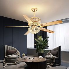 a living room with a ceiling fan and couches