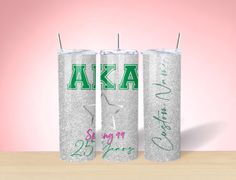 two personalized tumblers with the letters aka on them