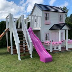 a pink slide is in front of a house