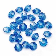 blue crystal faceted beads on white background with clippings to the side for use in jewelry making