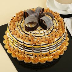 there is a cake that has been decorated with chocolate and nuts