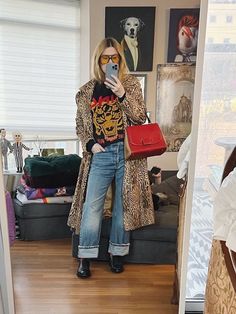 A blonde woman is wearing an animal print coat, Anine Bing sweatshirt, jeans, derby shoes, retro sunglasses, and a vintage Fendi bag. Print Coat Outfit, Leopard Cardigan Outfit, Freestanding Closet, Over 40 Fashion, Leopard Print Outfits, Leopard Jeans, 40 Fashion, Goose Sneakers, Out Of The Closet