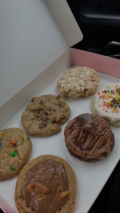 a box filled with lots of different types of cookies