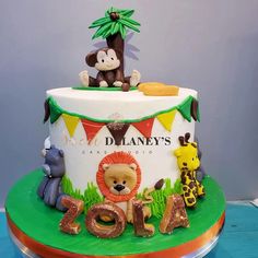 a birthday cake decorated with an animal theme