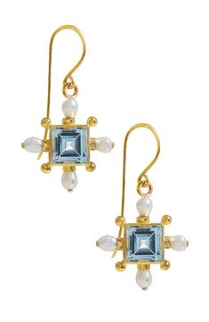 To celebrate Queen Elizabeth II’s platinum jubilee we've launched two exquisite Blue Topaz styles, one being these earrings, from our Regal 54 collection. Inspired by the frivolity and glamour of 1970s New York, the glittering energy of Studio 54, and the elaborate opulence of Tudor jewellery, the Regal 54 collection exudes divine femininity. More Details Handcrafted from 18ct gold plated sterling silver, Freshwater Pearls, and a statement Blue Topaz centre gemstone, the unique cross earrings ar 1970s New York, Platinum Jubilee, Studio 54, Rose Blue, Cross Earrings, Topaz Gemstone, Queen Elizabeth Ii, Elizabeth Ii, Signature Design