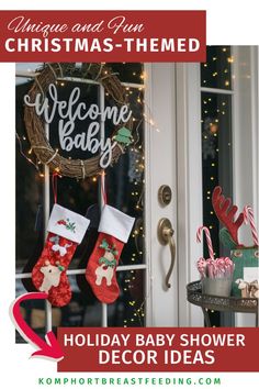 christmas stocking hanging from the front door with welcome baby sign and stockings on it