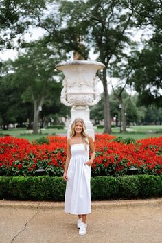 This stunning Lotus Dress in White features a strapless design with a smocked top for a flattering fit. It hits at a stylish midi length and is complete with functional pockets for added convenience. The waist seam detail adds a touch of elegance to this versatile dress that is perfect for any occasion. 100% cotton Not lined Model is 5'6" with a 34" bust, 27" waist, and 36" hips wearing a size small Size rec: S 0-4 M 4-6 L 8-10 Lotus Dress, Loungewear Summer, Smocked Top, Dresses By Length, European Summer, Versatile Dresses, Short Rompers, Set Dress, Midi Length