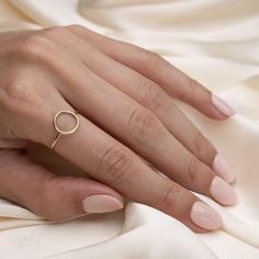 Gold Full Moon Ring Have the full moon at your finger tips. Handcrafted with precision, our Full Moon Ring is simple enough to be worn as an everyday piece and is sure to elevate your ring stack. Material: 14k Gold filled Minimalist Hypoallergenic Initial Ring, Hypoallergenic Minimalist Initial Ring, Hypoallergenic 14k Gold Round Midi Rings, 14k Gold Rings For Gift, 14k Gold Rings As Gift, 14k Gold Full Circle Rings As A Gift, Simple Round Initial Promise Ring, Hypoallergenic Midi Rings For Promise, Hypoallergenic Midi Promise Rings