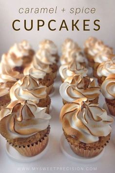 some cupcakes with white frosting on top and the words caramel spice cupcakes above them