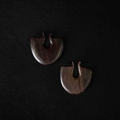 A Balinese exclusivity meticulously hand-sculpted from rich black wood, these hoop earrings seamlessly marry bold elegance with superior craftsmanship. Make a striking statement with these distinctive earrings, a true embodiment of Balinese artistry.  Design: by NOIR KĀLA Material: Black Wood Size: 8 cm x 8 cm Clasp diameter: 1.5 mm Weight: 13 g (pair) Ear Cuff Piercing, Snake Charmer, Ear Weights, Aging Beautifully, Wood Sizes, Wood Earrings, Balinese, Black Wood, Hair Jewelry