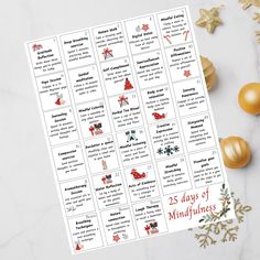 the 25 days of mindfulness stickers are shown next to christmas decorations and gold ornaments